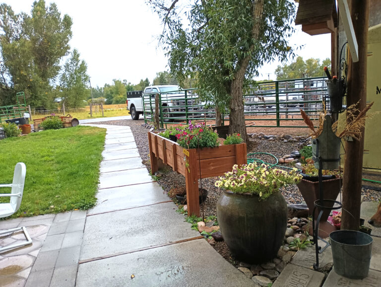 Garden patio with flower planters at Almosta Ranch near Bozeman, Montana