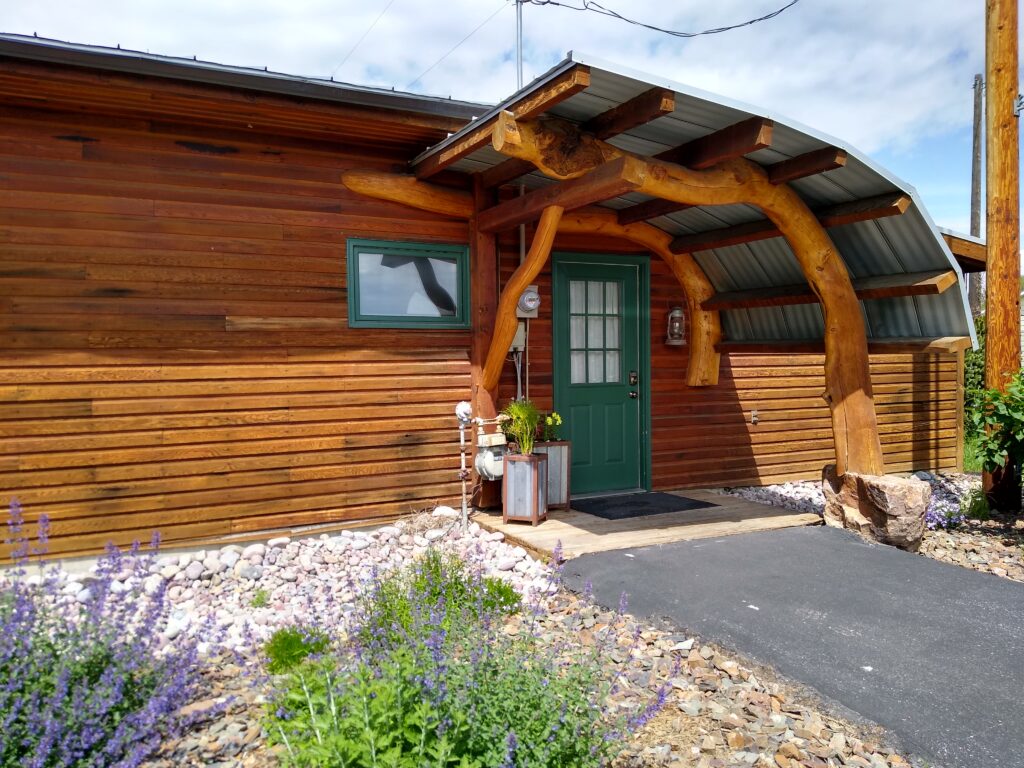 Exterior and entrance of the Gallatin River Cabin vacation rental in Montana