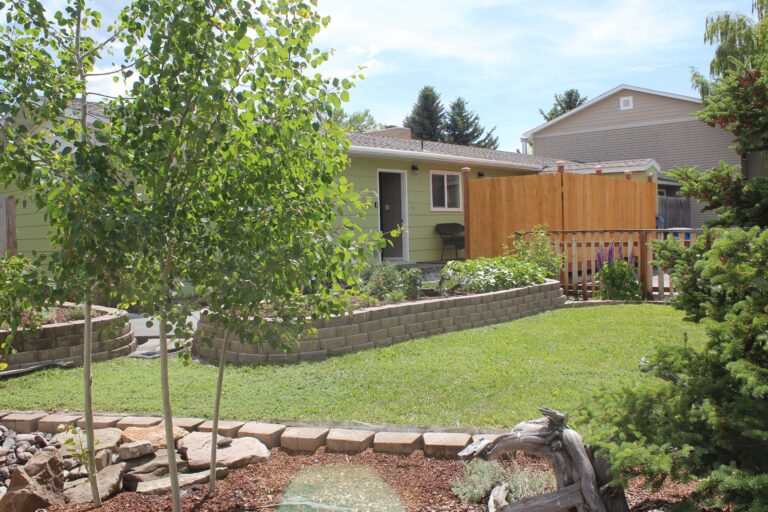 Front yard and landscaped garden at the Bridger Guest House vacation rental in Bozeman, MT