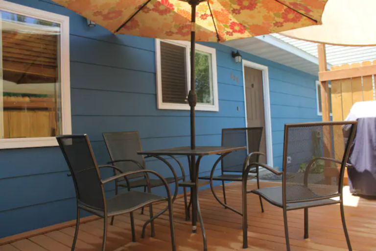 Patio with umbrella table at the Madison Guest House vacation rental in Bozeman
