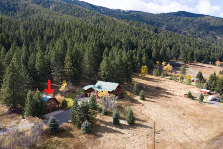Aerial view of the Flying J Bunkhouse in the forested Montana mountains