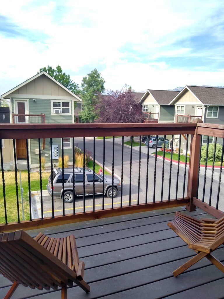 Private balcony with chairs at the Northside Condo vacation rental in Bozeman